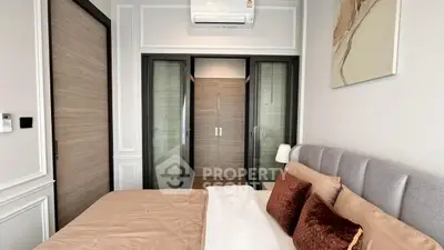 Modern bedroom with stylish decor and ample natural light