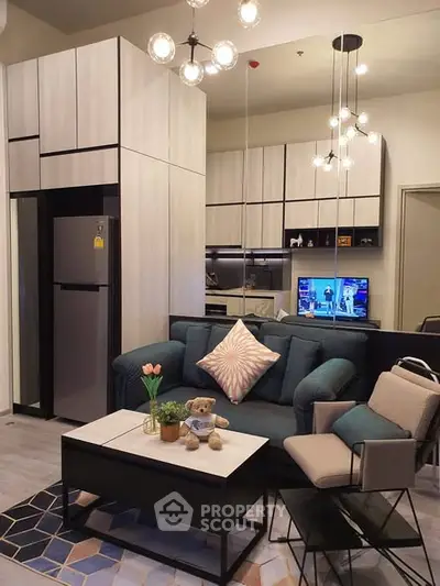 Modern living room with stylish furniture and open kitchen layout