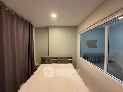 Modern bedroom with large window and stylish decor