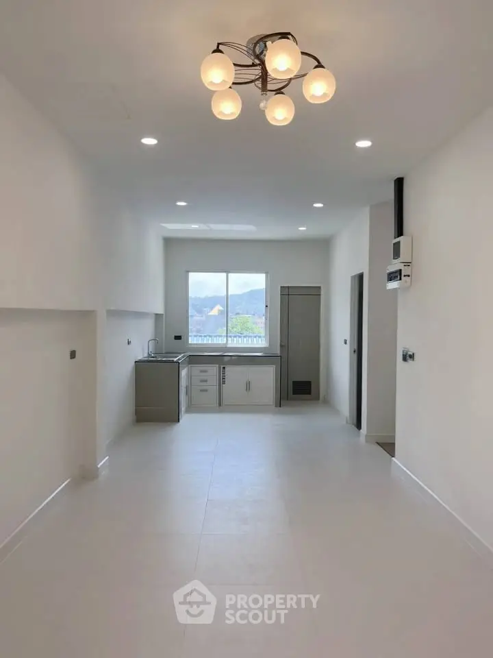 Spacious modern kitchen with open layout and elegant lighting