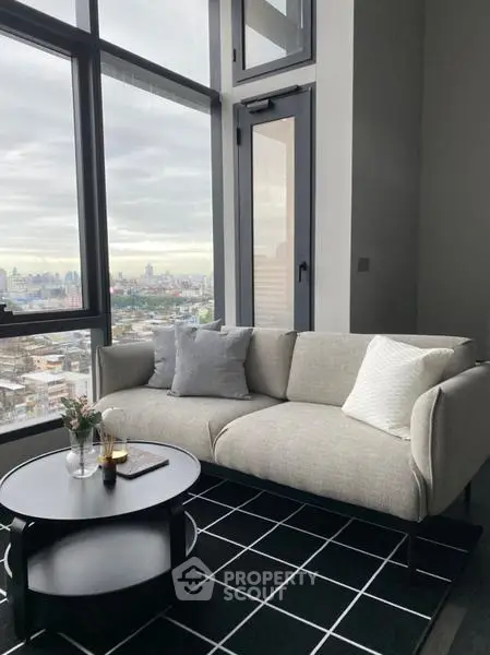 Modern living room with panoramic city view and stylish furniture