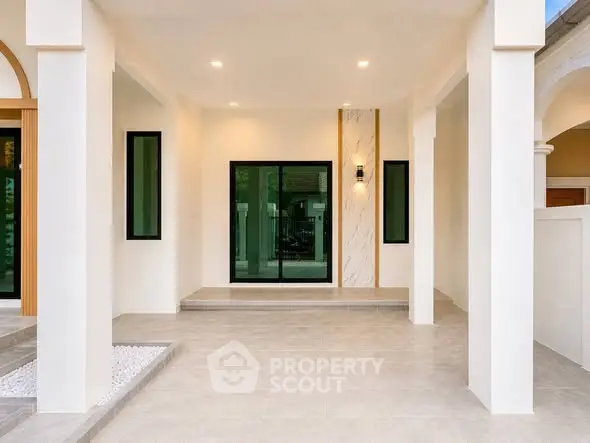 Modern minimalist home entrance with sleek design and elegant lighting