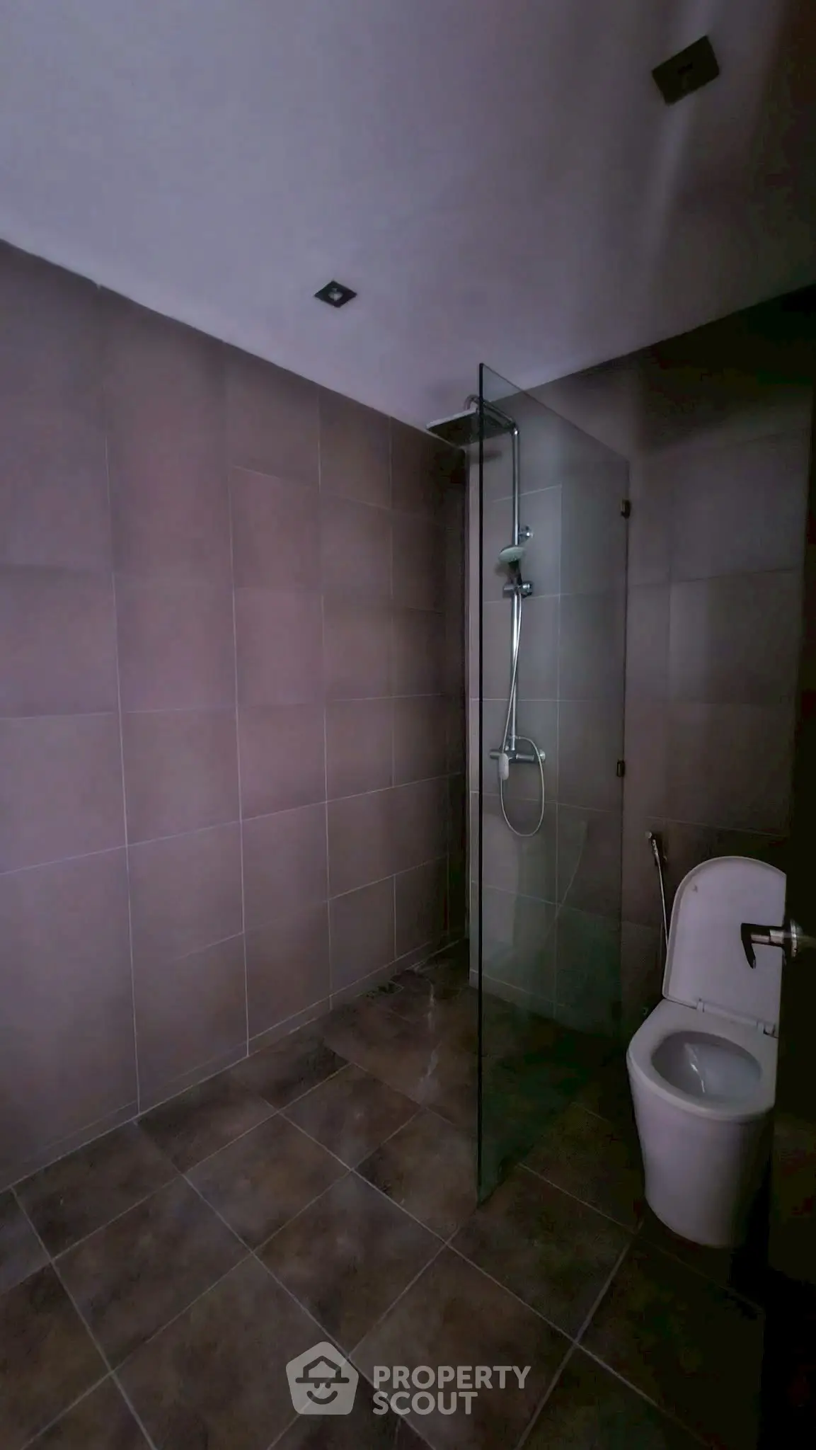 Modern bathroom with glass shower and sleek tile design