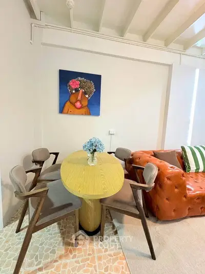 Chic living room with modern furniture and vibrant artwork, perfect for stylish urban living.