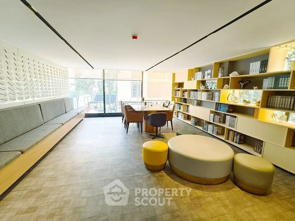 Modern living room with built-in seating and stylish bookshelf