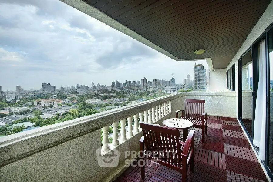 Spacious balcony with stunning city view, perfect for relaxation and entertainment.