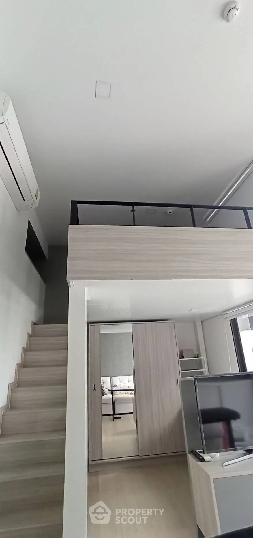 Modern loft apartment with mezzanine and sleek interior design