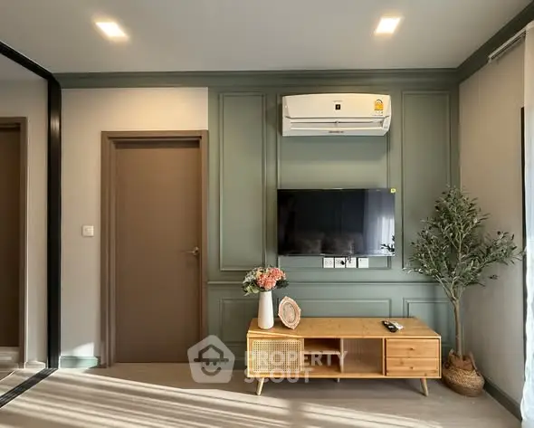 Modern living room with stylish decor and wall-mounted TV