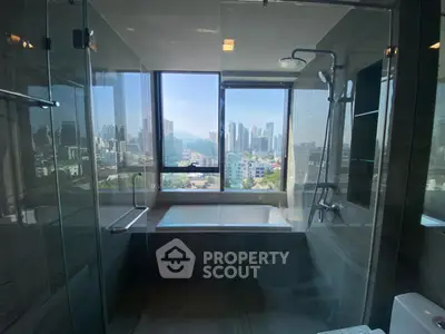 Luxurious bathroom with city view and modern fixtures