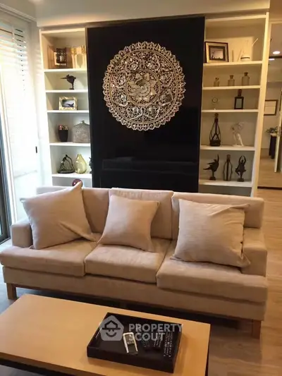 Elegant living room with stylish decor and cozy beige sofa, perfect for relaxation and entertainment.