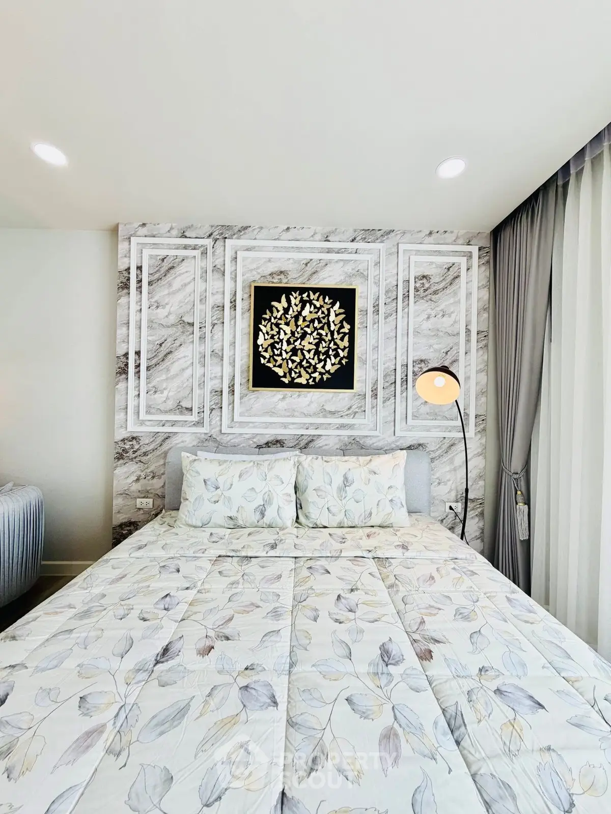 Elegant bedroom with stylish decor and modern lighting