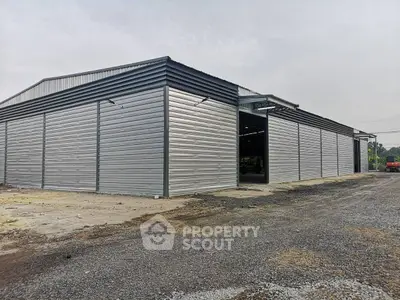 Spacious industrial warehouse with modern metal siding and ample outdoor space