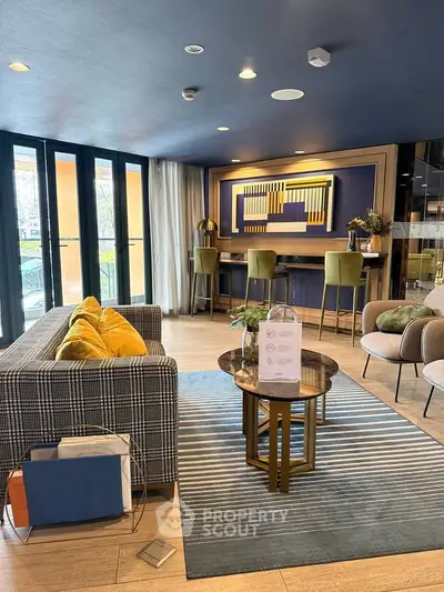 Stylish modern living room with chic decor and large windows