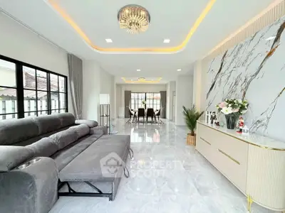 Luxurious modern living room with elegant marble wall and plush gray sofa