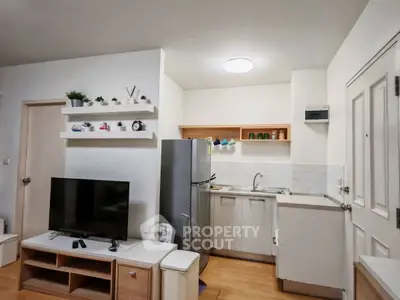 Modern compact kitchen with open layout and sleek appliances