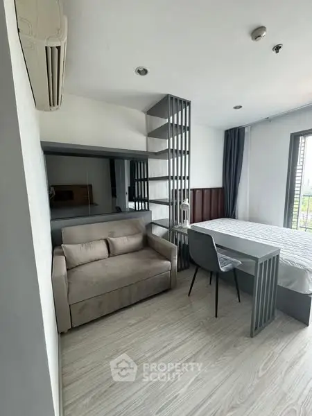 Modern studio apartment with sleek design and cozy furnishings