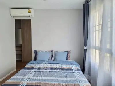 Cozy bedroom with natural light and modern decor, featuring a comfortable bed and stylish curtains.