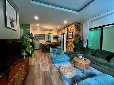 Stylish open-plan living room with modern decor and cozy seating area