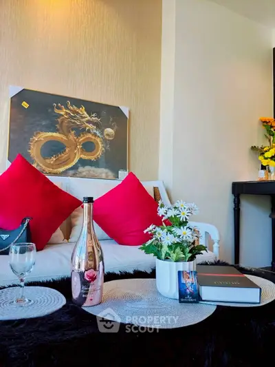 Stylish living room with elegant decor, featuring a dragon artwork and luxurious accents.