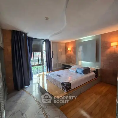 Luxurious bedroom with modern design and large window view