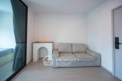 Modern minimalist living room with gray sofa and stylish decor