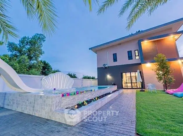 Luxurious modern home with unique pool and lush garden