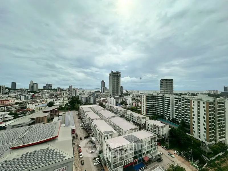 Stunning cityscape view from high-rise building showcasing urban skyline and residential areas.