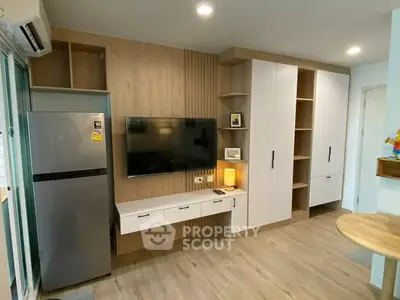 Modern living room with sleek TV setup and stylish storage solutions
