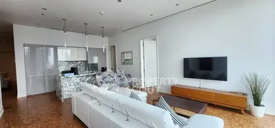 Spacious modern living room with open kitchen and stylish decor