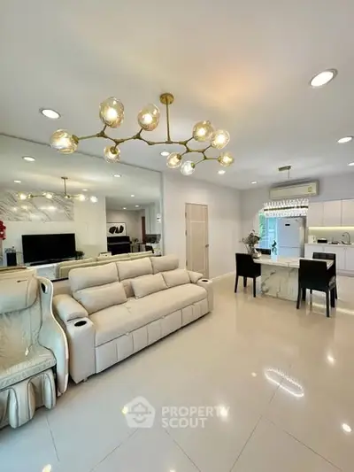Luxurious modern living room with elegant chandelier and spacious seating area