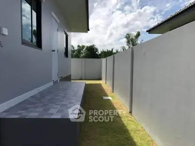 Modern home exterior with spacious backyard and sleek design