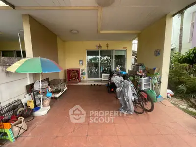 Spacious covered patio with garden view and ample storage space