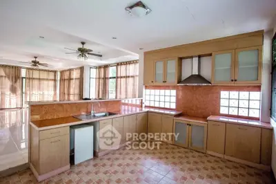 Spacious kitchen with open layout and modern design in a sunlit home.