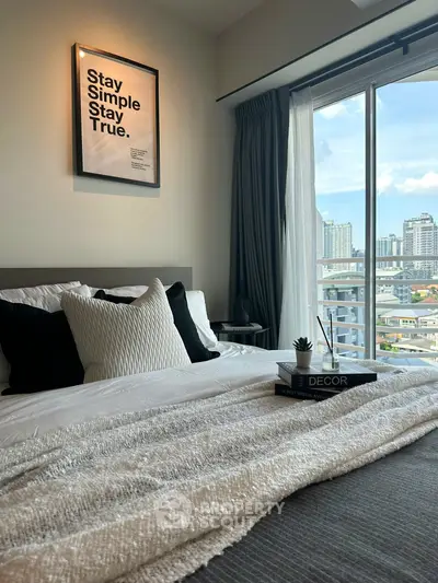 Modern bedroom with city view and stylish decor