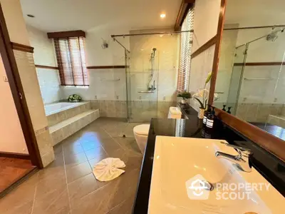 Luxurious bathroom with elegant bathtub and modern fixtures in a spacious layout.