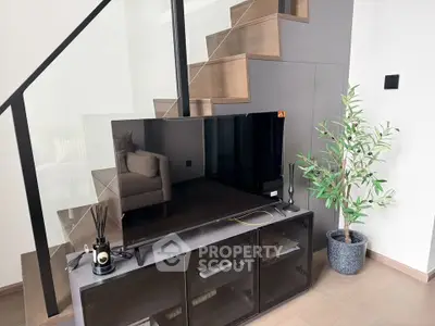 Modern living room with sleek TV setup and stylish decor