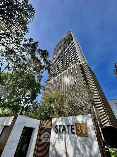 Stunning high-rise building with modern architecture and lush greenery at State 39.
