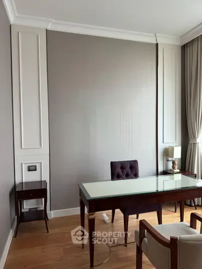 Elegant study room with classic wooden desk and plush chair, featuring floor-to-ceiling curtains and stylish wall paneling.