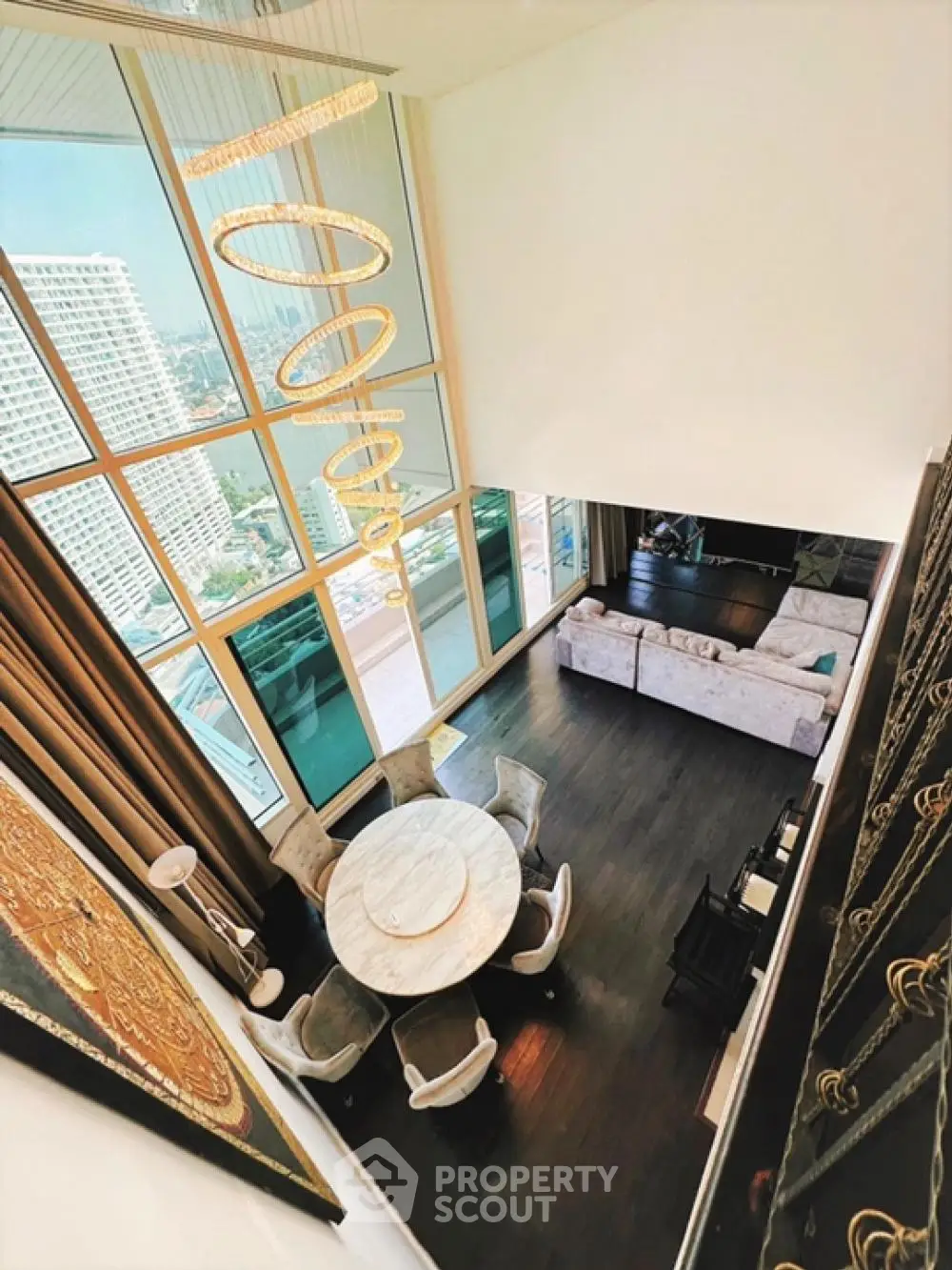 Luxurious high-rise living room with floor-to-ceiling windows and elegant decor