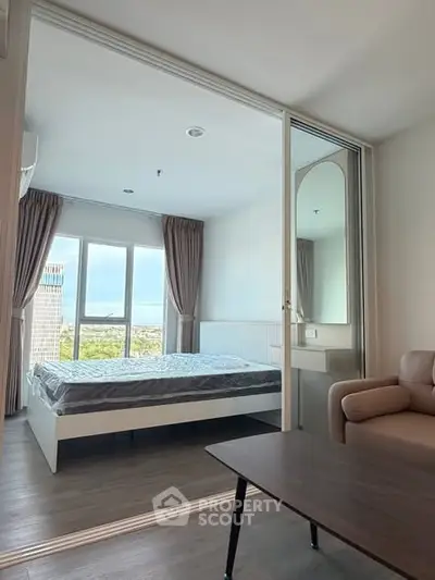 Modern bedroom with large window and city view, featuring cozy bed and stylish decor.