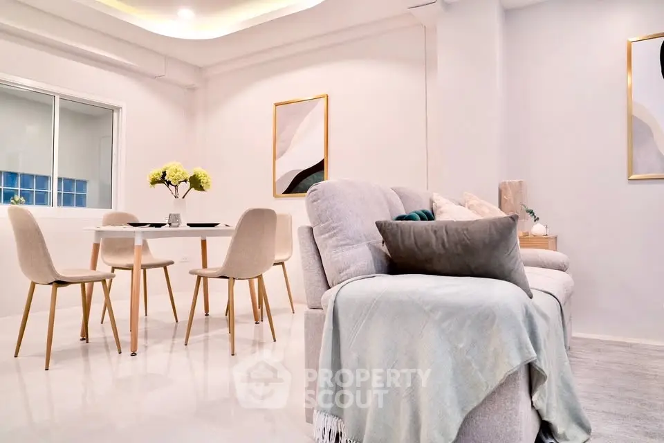 Modern living room with elegant dining area and stylish decor