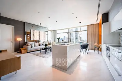 Luxurious open-plan living room and kitchen with city view, modern decor, and elegant furnishings.