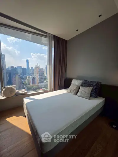 Modern bedroom with stunning city view and cozy decor