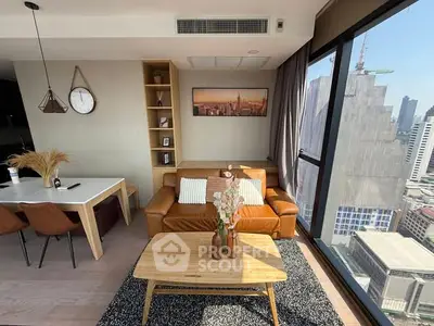 Modern living room with city view, leather sofa, and stylish decor