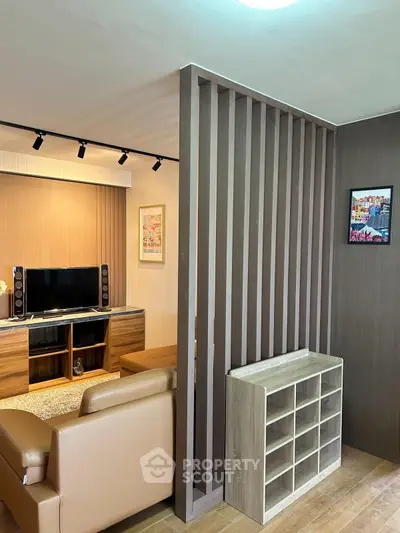 Modern living room with stylish partition and cozy seating area