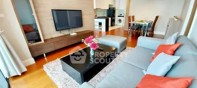 Spacious modern living room with elegant decor and open kitchen layout