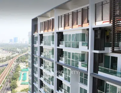 Modern high-rise building with expansive city views and sleek architectural design.