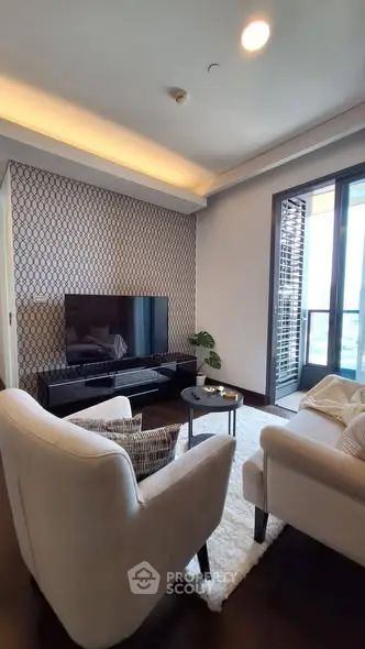 Stylish living room with modern decor and balcony access