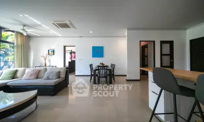 Spacious modern living room with open layout and stylish furniture, perfect for entertaining.