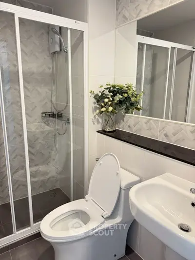 Modern bathroom with glass shower and elegant fixtures